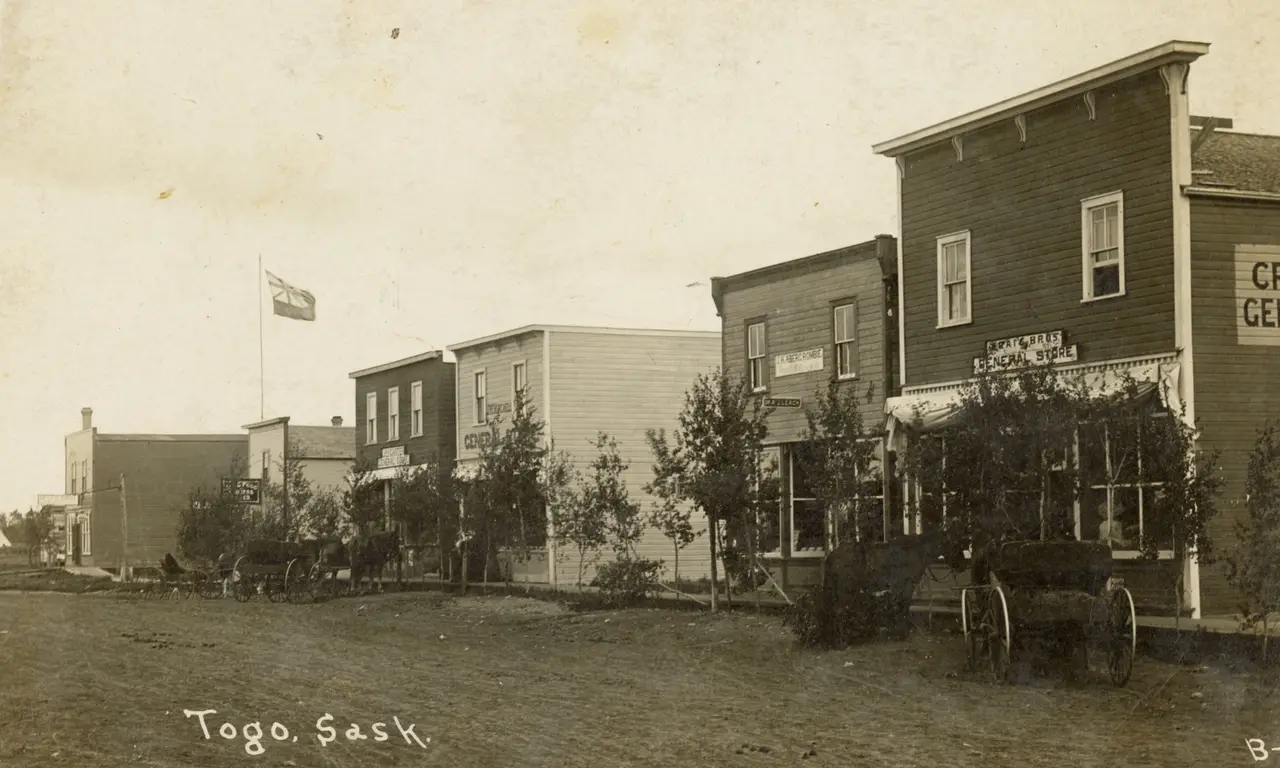 Main Street with general stores and wagons, about 1910